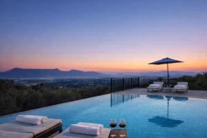 a swimming pool with a view of the mountains at Villa Olea Corfu - Private Pool & Panoramic Views in Perama