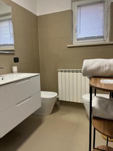 a bathroom with a sink and a tub and a toilet at Appartamenti Castel Ritaldi Il Sagrantino in Bruna +40 photos