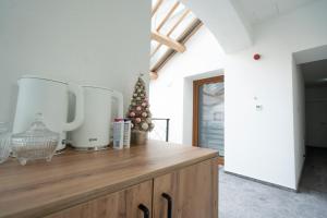 a kitchen with a christmas tree on a wooden counter at Boutique Hotel Una in Sarajevo