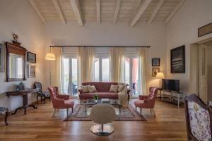 a living room with a couch and chairs at Villa Olea Corfu - Private Pool & Panoramic Views in Perama