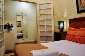 Ένα ή περισσότερα κρεβάτια σε δωμάτιο στο Hotel Aranjuez