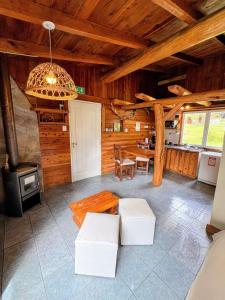 a living room with a table and a stove at Cabañas Walnor in Villa Traful +49 photos