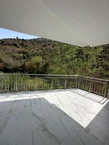 a balcony with a view of a mountain at Qyteza guest house in Shkodër +2 photos