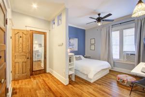 a bedroom with a bed and a ceiling fan at Splendid Colonial in Midtown with Parking in Memphis