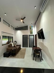 a living room with a couch and a table at Blue Wings Villa in Fortuna