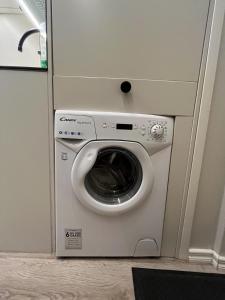 a washer and dryer in an airplane at Central Kamppi Micro Loft, Quiet Courtyard in Helsinki