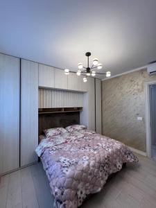 a bedroom with a large bed in a room at Fabio Home in Tirana