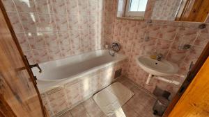 a bathroom with a tub and a sink at Penzión Magnólia in Trenčín +71 photos