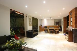 a living room with a table and a dining room at Jas Boutique Villas in Seminyak