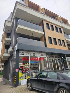 a car parked in front of a building at Dino Saraj in Skopje