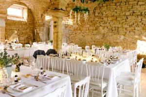 a wedding venue with white tables and chairs at Domaine de Bersaillin in Bersaillin +72 photos
