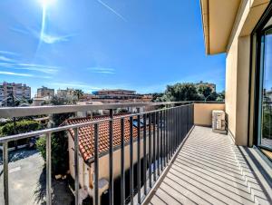 a balcony with a view of a city at La Régalide 2A in Roquebrune-Cap-Martin