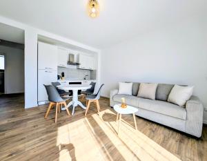 a living room with a couch and a table at La Régalide 2A in Roquebrune-Cap-Martin