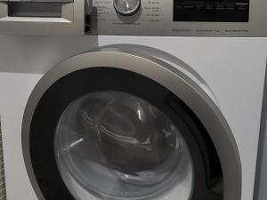 a close up of a washing machine with its door open at Ostoja Orli Dziób B2 in Kal