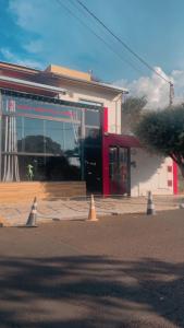 a building with orange cones in front of it at KS lazer e eventos in Ribeirão Preto