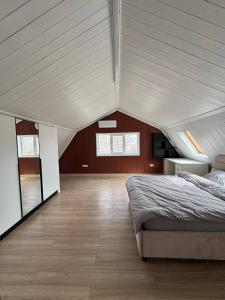a bedroom with a large bed in a attic at Odessky Dvorik in Chişinău