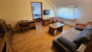 a living room with a couch and a table at Penzión Magnólia in Trenčín