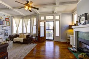 a living room with a couch and a fireplace at Elegant Colonial with Lovely Details and Character in Memphis