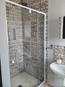 a bathroom with a shower and a sink at Casa de Marcos in Swakopmund +13 photos