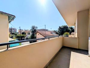 a balcony with a view of the city at La Régalide 2 B in Roquebrune-Cap-Martin