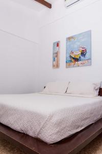 Postel nebo postele na pokoji v ubytování Café de Playa Beach Front Hotel