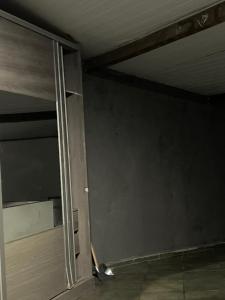 an empty room with a sliding glass door at Paradise in Natal