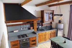 a kitchen with a stove and a counter top at Residenza Toscanini in Ravenna