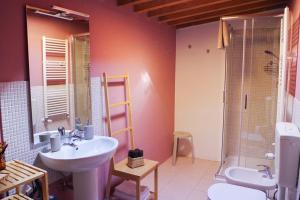a bathroom with a sink and a shower at Residenza Toscanini in Ravenna +20 photos