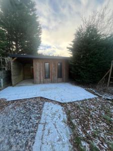a house with a large patio in front of it at The Summerhouse in Cheadle