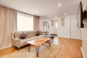 a living room with a couch and a table at Laurier Suites in Gatineau