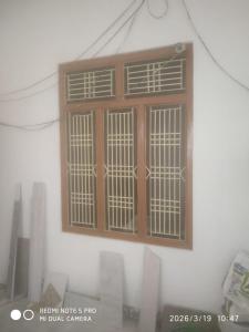 a window on the side of a building at The Four Season Pranav Resort - A Lavish Luxury Property in Nainital