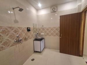 a bathroom with a sink and a shower at The Four Season Pranav Resort - A Lavish Luxury Property in Nainital