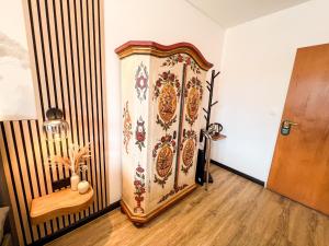 a room with a door with a painting on the wall at Hotel Berghof in Hellenthal +57 photos