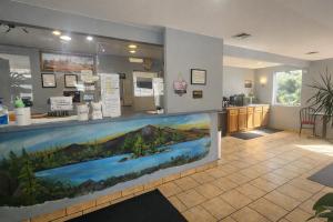 a room with a large painting on the wall at Sierra Inn in Prescott +58 photos
