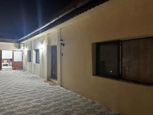 a hallway with a flat screen tv on a wall at Fabrizio house in Timişoara