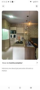 a screenshot of a kitchen with a picture of a counter at Condominio Central Charmoso in Uruguaiana