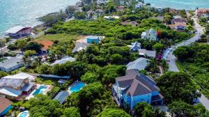 an aerial view of a house next to the ocean at DreamSpace Estate, Private Luxury Villa, Pool, Car and Beach in Nassau