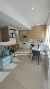 a living room with a couch and a table at Apartamentos Sudestada in Logroño +39 photos