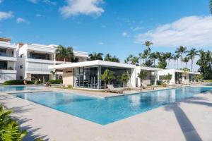 an image of a swimming pool at a resort at Sol de Arena Beachfront Condos by Bocobay in Las Terrenas