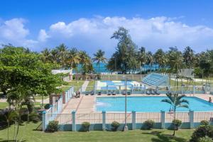 a view of a swimming pool at a resort at Playa Azul Beach by Otium in Luquillo