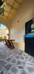 a room with a table and a large screen television at Mộc House in Ninh Hải