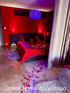 a red bedroom with a bed with red lights at Love Room L Interlude in Vitrolles