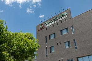 a building with a sign on the top of it at グリーンサンホテル in Shimo-suwa