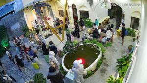a group of people standing around a fountain in a building at Mộc House in Ninh Hải +33 photos