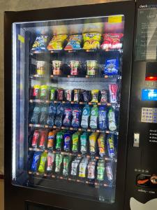 a vending machine filled with lots of drinks and soda at Ritsurin Boutique Hotel - โรงแรมริทสุริน บูติค in Phuket