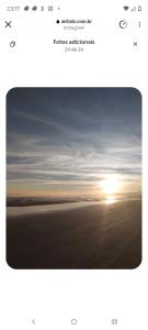 a screenshot of a picture of a sunset at Chalé Ahmar! in Jaguaruna