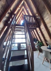 a staircase in the attic of a house at Chalé Ahmar! in Jaguaruna