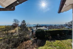 a view of the countryside from the garden of a house at Ferienwohnungen Meerblick Herde in Göhren