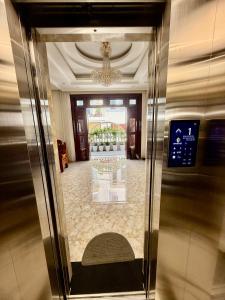 a lobby of a building with a glass door at Bibo House - Near Xuan Huong Lake & Center in Da Lat