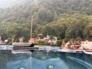 a large swimming pool in front of a mountain at Kings Palace in Kathmandu